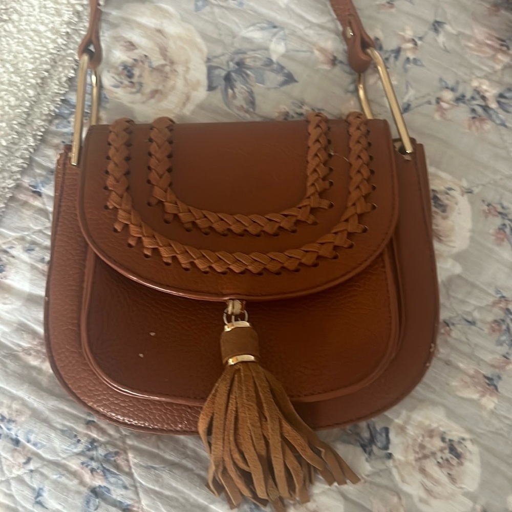 Brown braided crossbody with tassel detail